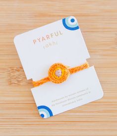 This unique evil-eye-inspired rakhi is handwoven by women artisans of Himalayan Blooms, a nonprofit empowering rural communities in Uttarakhand, India. Each purchase supports sustainable livelihoods and meaningful change. -One size fits all. -Adjustable medallion. Rakhi Greetings, Rakhi Cards, Handmade Rakhi, Handmade Beauty Products, Raksha Bandhan, Empower Women, Nonprofit Organization, Women Artisans, Cute Packaging