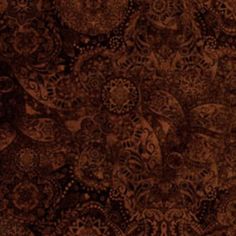 a brown and black background with lots of different designs on it's surface, including an intricate design