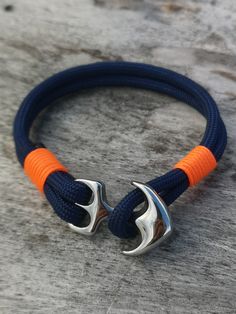 "Each MARE NOSTRUM creation bracelet that I make is a handmade piece. All my bracelets are entirely made in France, in Cap d'agde. may differ from the pictures. Each order is prepared with the utmost care and packed in a linen / cotton pouch. This bracelet is made of nautical or paracord ropes lined and tied with a sailor knot. The \"anchor\" type clasp in 316 L stainless steel (medical grade) measuring 36 mm x 25 mm in size fits perfectly with this string. The paracord strapping on each side of the anchor gives a couture effect to this bracelet. Can present differences with the photos. Sizes may vary +/- 0.5cm Feature: PARACORDE TYPE IV Color: NIGHT BLUE Diameter: ca. 4.2mm High quality wires Made in the USA. Washable at 30 o C max Cord specifications: PARACORDE MICRO TYPE 1.2 MM  Seconda Blue Bracelets With Stainless Steel Clasp As A Gift, Handmade Nautical Adjustable Bracelets, Handmade Adjustable Nautical Bracelets, Nautical Blue Bracelets As A Gift, Nautical Blue Bracelets For Gifts, Blue Nautical Bracelets For Gift, Blue Nautical Bracelets As Gifts, Blue Nautical Style Bracelet For Gift, Hand Embroidery Letters