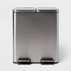 a stainless steel trash can on a white background