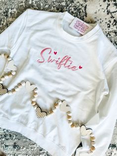 Swiftie Embroidered Sweatshirt - Tee ✨Color Options available for Embroidery & Top options ✨Message me for inquiries  ✨Be sure to follow @Beautyandawish on Instagram for updates and more product availability! Cute Long Sleeve T-shirt With Embroidered Text, Basic Relaxed Fit Top With Custom Embroidery, Basic Cotton Tops With Custom Embroidery And Relaxed Fit, White T-shirt With Letter Embroidery As Gift, Crew Cotton Top With Machine Embroidery, Cotton Crew Neck Top With Machine Embroidery, Cute Crew Neck Sweatshirt With Embroidered Text, Cute Cotton Sweatshirt With Custom Embroidery, Spring Long Sleeve T-shirt With Letter Embroidery