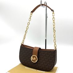 Brand New With Tag Michael Kors Carmen Small Pouchette Crossbody Bag Color: Brown Material: Saffiano Gold-Tone Hardware Chain Handle Flap With Magnetic Snap Button Closure Interior Features: 1 Wall Pocket 9.25”W X 4.5”H X 2.75”D Brown Baguette Bag With Branded Hardware For Travel, Brown Baguette Shoulder Bag With Branded Hardware, Brown Shoulder Baguette Bag With Branded Hardware, Elegant Brown Baguette Bag With Branded Hardware, Formal Brown Baguette Bag With Branded Hardware, Michael Kors Brown Bag With Chain Strap, Michael Kors Shoulder Bag With Branded Hardware For Office, Michael Kors Shoulder Bag For Office, Michael Kors Shoulder Bag With Gold-tone Hardware For Office