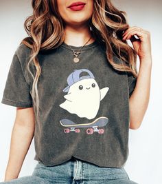 Cute Ghost Shirt , Vintage Halloween Shirt Sweatshirt, Spooky Season Shirt, Fall Vibes Shirt, Autumn Vibes Shirt NOTE ABOUT SHIPPING & CUSTOMS I use local printers in United States, Canada, UK, Australia. Germany & Italy. This ensures that you will never be charged with surprise customs fees on your tee. . All t-shirts are custom made to order and are printed using the latest ink to garment technology, a technology superior to heat transfer or screen print. - Heather colors are 52% combed and ri Casual Fall Shirt With Cartoon Print, Casual Halloween T-shirt For Streetwear, Fall Cotton Shirt With Cartoon Print, Casual Cartoon Print Shirt For Streetwear, Casual Halloween Streetwear Tops, Casual Relaxed Fit Shirt With Cartoon Print, Casual Fall T-shirt With Cartoon Print, Casual Streetwear Shirt With Character Print, Casual Character Print Shirt For Streetwear