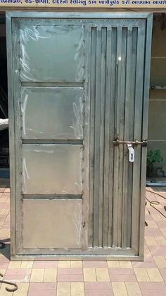 an open metal door on the side of a building