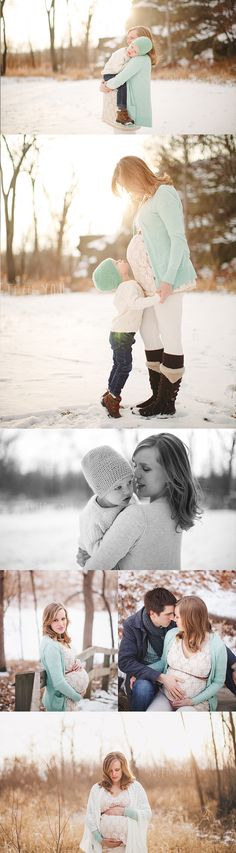 two people are kissing in the snow and one person is sitting down with their arms around each other