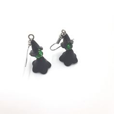 These witch earrings are a must-have accessory for any lover of the dark and magical. Handmade with 4mm black beaded pieces, green bead head, and silver ear-wire, these earrings are a simple yet stylish addition to any Halloween outfit. Whether you're attending a party or just looking to add some spooky flair to your everyday look, these earrings are a perfect choice. Don't miss out on this must-have accessory for the season of the witch! 🪄 Free shipping on all orders $35 or above 🪄 Each piece Black Single Earring For Halloween, Witchy Black Nickel-free Earrings, Nickel-free Black Spooky Earrings, Green Halloween Party Earrings, Green Halloween Dangle Earrings, The Season Of The Witch, Earrings Gothic, Beautiful Birthday Cards, Witch Earrings