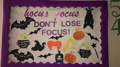 a sign that says hocacs focus don't lose focus with bats and witches on it