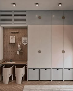 a room with several storage units and stools next to a wall that has wood paneling on it