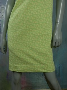 This 1960s Swedish vintage shift dress has a delicate yellow floral pattern on a mint green background. The sleeveless slip-on dress has a square bateau neckline and a green polyester lining. Bust = 37 inches (93.98cm) Waist = 37 inches (93.98cm) Hips = 37 inches (93.98cm) Dress Length = 35.5 inches (90.17cm) Brand label: Ajco (Made in Sweden) Size: 6/8 US/UK Material: Diolen Polyester Condition: Excellent (clean, soft, and supple, with no stains, tears, wear spots, or weaknesses in the seams) - Green Spring Dress With Straight Neckline, Green Stretch Dresses With Square Neck, Green Stretch Square Neck Dresses, Green Square Neck Stretch Dresses, Green Square Neck Daywear Dress, Green Square Neck Dress For Daywear, Green Knee-length Mod Dress, Green Mod Knee-length Dress, Retro Green Square Neck Dress