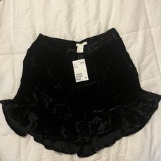 Black Velvet Ruffle Shorts With Pockets! Short Ruffle Bottoms For Night Out, Ruffled Short Length Bottoms For Night Out, Ruffled Short Bottoms For Night Out, Ruffled Bottoms For Night Out, Ruffled Shorts For Night Out, Black High-waisted Ruffled Shorts, High Waist Black Ruffled Shorts, High Waist Black Shorts With Ruffles, Casual Ruffled Shorts For Night Out