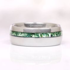 Green Moss Agate Men's Wedding Band - a testament to the timeless union of natural elegance and modern craftsmanship. This exquisite piece of jewelry seamlessly blends the rugged beauty of nature with the durability of contemporary materials, making it the perfect symbol of your enduring love and commitment.►Crafted with precision and passion, this wedding band features a striking 8mm wide band made from lustrous silver tungsten. Tungsten is renowned for its strength and resilience, ensuring tha Minimalist Titanium Jewelry For Formal Occasions, Elegant Tungsten Carbide Jewelry For Gift, Elegant Tungsten Carbide Jewelry As A Gift, Modern Stainless Steel Wedding Jewelry, Round Tungsten Carbide Jewelry Gift, Elegant Tungsten Carbide Wedding Jewelry, Minimalist Titanium Jewelry For Anniversary, Modern Green Jewelry For Promise Occasion, Modern Silver Tungsten Carbide Jewelry