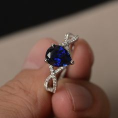 This is a gorgeous handmade creation. Its beauty is its simplicity & Elegance. The 7*9 mm pear shape faceted lab sapphire is crafted in solid sterling silver and with rhodium plated. All item is sent in a beautiful gift box If you have any idea of design your ring,pls contact me directly. You can realize more lovely stuff clicking the link https://www.etsy.com/shop/knightjewelry?refshopsection_shophome_leftnav Please leave the correct address and you phone number for delivering successfully. Pear-shaped Sapphire Ring, Fine Jewelry Pear-shaped Sapphire Ring, Blue Pear-shaped Sapphire Ring, Blue Pear-shaped Sapphire Ring With Accent Stones, Blue Sapphire Pear-shaped Ring, Pear-shaped Blue Sapphire Ring, Blue Pear-shaped Sapphire Ring With Cubic Zirconia, Pear-shaped Lab-created Sapphire Jewelry, Teardrop Blue Sapphire Ring With Diamond