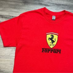 Mens Vintage Ferrari T-Shirt Size Medium All Sizes Available On My Page Fully Embroidered Brand New Measurements- Pit To Pit 23 Inches Length 27 Inches Message For Questions Red Embroidered Logo T-shirt For Streetwear, Red Crew Neck T-shirt With Embroidered Logo, Red Tops With Embroidered Graphics For Streetwear, Red Embroidered Streetwear Tops, Sports T-shirt With Embroidered Logo, Red Embroidered Tops For Streetwear, Red T-shirt With Embroidered Logo For Streetwear, Sporty Red Tops With Embroidered Logo, Red Crew Neck Top With Embroidered Logo