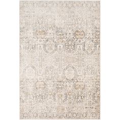 an area rug with various colors and patterns on the floor, including beiges, browns, and creams