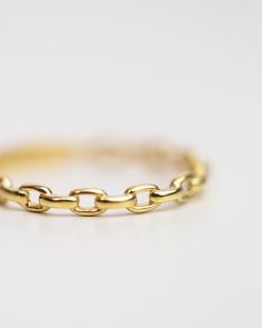 14k Solid Oval Link Ring Crafted from 14-karat yellow gold, this timeless piece features open oval links, lending a delicate, chain-like aesthetic to any stack of rings. Perfect for elevating any look with an effortless touch of elegance. Material: 14k Yellow Gold Width: 2.2mm Gold Oval Stackable Rings, Tarnish Resistant, Gold Oval Stackable Rings Tarnish Resistant, Classic Gold Chain Ring With Oval Link, Adjustable Link Chain Ring In Yellow Gold, Elegant Gold Oval Link Chain Ring, Everyday 14k Gold Oval Stackable Rings, Elegant Gold Chain Rings For Everyday Wear, Classic Yellow Gold Chain Ring, Elegant Everyday Yellow Gold Chain Ring