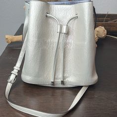 Calvin Klein Gabrianna Novelty Bucket Bag. Adjustable Shoulder Strap, Easy Access, And Shimmery, Gold And Silver Iridescent Design. Vegan Leather With Calvin Klein Signature Logo And Branding. With Snap Closure. Iridescent Design, Calvin Klein Bags, Logo And Branding, Calvin Klein Bag, Metallic Purse, Signature Logo, Womens Calvin Klein, Gold And Silver, Easy Access