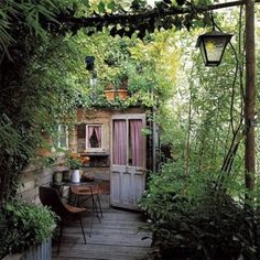 an advertisement for sliding door hardware on the outside of a house with lots of greenery