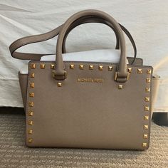 Michael Kors, Dark Dune Medium Selma Satchel With Gold Studs. Soffiano Leather. Never Used, Still Has All Original Packaging And Storage Bag Designer Gray Shoulder Bag With Gold-tone Hardware, Designer Taupe Bags With Gold-tone Hardware, Designer Gray Bag With Branded Hardware, Gray Rectangular Bag With Gold-tone Hardware, Gray Leather Bag With Gold-tone Hardware, Tuxedo Shoes, Lv Pochette, Gucci Soho Disco, Mk Handbags