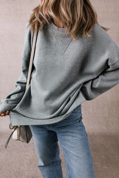 Elevate Your Wardrobe with the Medium Grey Side Split Drop Shoulder Oversized Sweatshirt Experience the perfect blend of comfort and style with our Medium Grey Side Split Drop Shoulder Oversized Sweatshirt. This essential piece is designed for those who appreciate effortless chic in their daily attire. Product Highlights: Chic Design: Features a stylish side split that adds a contemporary flair to your casual look. Laid-Back Elegance: The drop shoulder design enhances the relaxed vibe, making it Relaxed Fit Drop Shoulder Sweater For Fall, Relaxed Fit Fall Sweater With Drop Shoulder, Relaxed Fit Sweater With Drop Shoulder For Fall, Gray Oversized Drop Shoulder Sweatshirt, Oversized Cozy Solid Color Tops, Oversized Gray Drop Shoulder Sweatshirt, Gray Oversized Casual Sweater, Oversized Basic Plain Sweater, Oversized Gray Casual Sweater