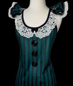 PLEASE "READ" ENTIRE DESCRIPTION  PLEASE click (+More) below for FULL DESCRIPTION HAUNTED MANSION MAID TOP Covered Tank Top Green Black Stripe Ruffle Elastic Neckline SIZES & CONTENT *Please see Photos for Sizes & Content BUST: 1" below armhole . all around LENGTH: Top of Shoulder to Hem **ADD.ON * SOLD SEPARATELY Shoulder Ruffles  Layers of Poly Mesh & Minky Sequin Edge **May ONLY be purchased with Top** *Measurements are the ACTUAL Measurements of the Top Laying Flat - Unstretched ADD.ONS . SOLD SEPARATELY  TUTU & Accessories can be found at: https://tutufactoryusa.etsy.com/listing/1757550025 Come visit my store to see lots more: https://www.etsy.com/shop/TutuFactoryUSA IMPORTANT NOTE: Although I do my best to keep all fabrics & trims on hand for all potential orders, there are times whe Black Ruffled Top For Halloween, Haunted Mansion Maid Outfit, Gothic Sleeveless Tank Top For Cosplay, Halloween Black Ruffled Top, Haunted Mansion Maid, Plus Size Running, Fitted Victorian Ruffle Top, Goth Clothes, Frankie Stein