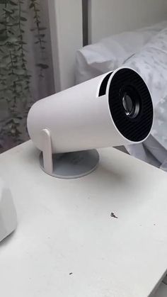 a white camera sitting on top of a table