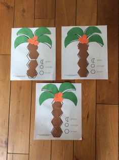 three pieces of paper that have been cut out to look like a palm tree with orange flowers