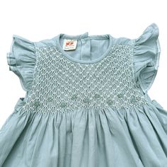 The Pastel Mint Smocked Dress embodies the essence of springtime freshness and effortless charm. It has deliciated hand smock from shoulder to chess, suitable for both formal and casual occasions.  * 100% Cotton * 100% Handmade * Tie at the back * Soft cotton, comfortable, and ready to play * Hand wash or machine wash on a delicate setting We are based in Sydney, New South Wales, Australia. We ship within Australia and to other countries as well. The shipping fee is vary based on the destination Spring Smocked Dress With Flutter Sleeves, Spring Smocked Dress With Flutter Sleeves And Smocked Bodice, Summer Cotton Smocked Dress With Flutter Sleeves, Ruffle Sleeve Dress With Smocked Back For Garden Party, Flutter Sleeve Dress With Smocked Bodice For Garden Party, Spring Dresses With Smocked Bodice And Ruffle Sleeves, Garden Party Smocked Dress With Ruffle Sleeves, Flutter Sleeve Smocked Dress With Ruffles For Garden Party, Casual Smocked Dress With Ruffle Sleeves For Garden Party