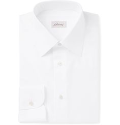 Ever since it set up shop in Rome in 1945, Brioni has been an authority on impeccable tailoring. Cut for a slim fit, this white shirt has been expertly made at the label's Italian atelier from crisp cotton-poplin and is topped with a starched classic collar. Wear it everywhere from the office to formal events. Shown here with Brioni jacket, TOM FORD shoes, TOM FORD tie, Turnbull & Asser pocket square. Designer Cotton Dress Shirt For Business, Designer Cotton Dress Shirt For Office, Timeless Cotton Dress Shirt, Luxury Cotton Dress Shirt For Semi-formal Occasions, Luxury White Cotton Dress Shirt, Luxury Cotton Shirt With Button Closure, Designer Business Dress Shirt, Luxury Cotton Dress Shirt For Business, Luxury Cotton Dress Shirt For Office