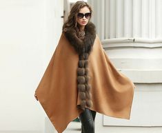 Description  Commodity : Real Cashmere real fox fur coat/ poncho /shawl   Material 10% Cashmere  + 90% W ool + R eal B est F ox F ur ; Size  ；The  long about 198cm=77.95inch;                 The Wide about 65cm=25.59inch    Color ； Brown Attention UK and EU buyers! According to the current platform and your local policy, the purchase of item more than 135 Pounds or 150 Euros, the platform does not collect  any taxes and fees, and buyers need to pay VAT taxes and tariff by themselves. Please note Brown Cape For Cold Weather, Brown Winter Cape For Cold Weather, Brown Winter Cape, One Size Brown Cape Outerwear, Wraps For Party, Poncho Cloak, Cape Fashion, Cloak Coat, Poncho Coat