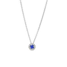 Adorn yourself with elegance using our white gold necklace featuring a stunning blue sapphire surrounded by a halo of diamonds. Sapphire Platinum Jewelry With Pave Setting, Blue Platinum Jewelry With Pave Setting, Blue Platinum Necklace With Brilliant Cut, Blue Brilliant Cut Platinum Necklace, Sapphire Necklaces With Halo Setting, Blue Diamond Necklace With Pave Setting, Elegant Blue Necklace With Pave Setting, Formal Sapphire Necklace With Halo Setting, Elegant Blue Necklaces With Pave Setting