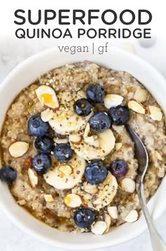 a bowl of oatmeal with blueberries and almonds on top is shown