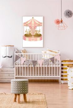 a baby's room with pink walls and white crib in the foreground