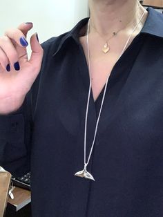 "This awesome sea inspired pendant features a 925 sterling silver Fluke Whale, Dolphin and sterling silver chain, I have chains for men and women. I strongly recommend curb chains for this beautiful treasure. More Whale tail designs: http://etsy.me/2lwPnrj Big collection mens Necklaces: http://etsy.me/1DwrNLc More Symbolic Jewelry? http://etsy.me/16So5MK . Cast using 100% sterling silver, no pewter, nickel or lead was used to create this piece, buy with peace of mind. ☮ ツ Need initials, birthsto Whale Fluke, Whale Tail Jewelry, Tail Designs, Whale Tail Necklace, Mens Necklaces, Sea Inspired, Symbolic Jewelry, Whale Tail, Meaningful Jewelry