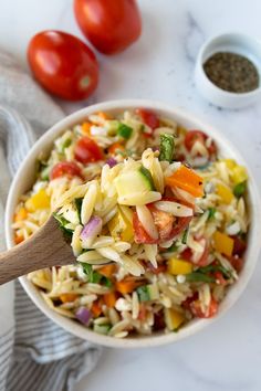 Rainbow Orzo Salad on a wooden spoon with a big bowl of rainbow orzo salad in the background. Bbq Side Dish, Colorful Salad, Bbq Side, Best Pasta Salad, Dinner Side, Orzo Salad, Easy Pasta Salad, Salad Side Dishes, Pasta Salad Recipes