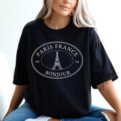 THANK YOU FOR SHOPPING WITH US "Bonjour fashionistas! Get ready to say adieu to boring t-shirts and bonjour to this stylish and chic Paris France tee! Featuring a stunning image of the iconic Eiffel Tower, this tee is a must-have for any fashion-forward traveler. Made on the high-quality comfort colors t shirts, this tee is not only comfortable, but also durable enough to withstand all your adventures in the City of Lights.  Perfect for group trips, this tee will unite your squad and make for th Paris Girls Trip, Trip Shirts, Girls Trip Shirts, Travel Tees, Paris T Shirt, Travel Shirts, Parisian Style, Girls Trip, Denim Wash