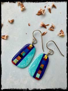 Native American slab earrings with inlay by artist Ronald Chavez (turquoise & lapis) Beautiful slab earrings with pale blue turquoise, multi stone inlay and deep blue lapis lines. By the talented Santo Domingo artist Ronald Chavez. Measurements : 1" X 5/8" turquoise, lapis, multi stone inlay sterling silver Abstract Ideas, Paper Earrings, Stone Inlay, Blue Lapis, Wooden Earrings, Multi Stone, Blue Turquoise, Pale Blue, Deep Blue