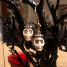 "Make all of your \"Ghoul-friends\" jealous with these adorable Skull Dangle Earrings. This is Spooky Vintage Glamour at its best!                                  The perfect October Hostess Gift  These bone- colored howlight skull beads are accentuated with black faceted crystals and 4mm Czech glass crystals.   1 1/4\"L x 1/2\" W These dangle skull earrings will complete your Halloween wardrobe! You want to see these earrings in multi- colors?! Check out the Colored Skull Earrings here: https: Nickel-free Skull Jewelry For Party, Spooky Halloween Costume Party Jewelry, Spooky Halloween Jewelry For Costume Party, Skull Jewelry For Day Of The Dead Party, Skull Shaped Jewelry For Day Of The Dead Party, Gothic Skull Earrings For Party, Halloween Themed Jewelry For Costume Party, Themed Jewelry For Halloween Costume Party, Handmade Jewelry For Halloween Party