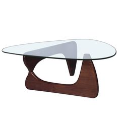 a glass and wood coffee table with an unusual shaped design on the top, against a white background