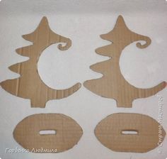 three wooden cut outs with christmas trees on them