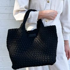 Our most popular woven totes are handwoven with a lycra blend and contrasting weave. Each tote comes with a matching pouch and detachable strap to transform your tote into a crossbody! Color: Bone Dimensions: Expanded: 18” x 9” x 8” / 6” Handle Drop Black Bag With Intrecciato Weave For Everyday, Woven Double Handle Bags For On-the-go, Black Woven Leather Bag For Everyday Use, Everyday Intrecciato Weave Tote Bag, Everyday Intrecciato Tote Bag, Black Straw Bag With Intrecciato Weave For Shopping, Black Woven Straw Crossbody Bag, Black Woven Leather Shoulder Bag For On-the-go, Black Straw Shopping Bag With Intrecciato Weave