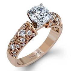 a rose gold engagement ring with an oval cut diamond