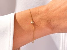 A luxurious addition to any ensemble, this Diamond Bee Bracelet in 14k Gold exudes glamour and sophistication. Featuring a 14k Gold setting and a shimmering Diamond Bee charm, this is the perfect piece for those with a taste for high-end fashion. Features• Made to Order• Gold Kt: 14K• Gold Color: Rose Gold, Yellow Gold, White Gold• Gem Stone: Natural White Diamonds• Diamond Cut: Marquise• Number of Stones: 2• Available Stone Sizes: 2 x 1.50 x 3.00 mm• Total CTW: 0.05 ct• Diamond Color - Clarity: Fine Jewelry Bracelets With Diamond Accents For Gifts, Hand Set Diamond Bracelet Gift, Elegant Diamond Cut Bracelet Perfect As A Gift, Elegant Diamond Cut Bracelet As Gift, Elegant Diamond Cut Bracelet For Gift, Timeless Yellow Gold Tennis Bracelet Gift, Yellow Gold Tennis Bracelet As A Gift, Yellow Gold Tennis Bracelet - Fine Jewelry Gift, Dainty Yellow Gold Bracelet For Formal Occasions