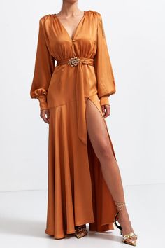 Glamorous Formal Belted Dress, Glamorous Belted Formal Dresses, Luxury Gold V-neck Dress, Glamorous Belted Dress For Formal Occasion, Gold Satin Maxi Dress For Date Night, Gold Satin Maxi Dress For Cocktail, Formal Brown Belted Dress, Evening Satin Belted Maxi Dress, Elegant Party Dress With Belt Detail