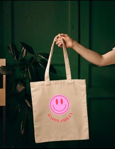 Fabric bag smiley, shoulder bag, smiley jute bag, shopping bag with smiley, shopper, neon pink, farewell gift, birthday gift Our shopper is the perfect shopping bag, it combines style and functionality and is the perfect companion for your everyday life. The smiley jute bag is made of 100% cotton and offers enough space for everything you need - be it for shopping, university or the beach. With our unique design you stand out from the crowd and make a statement. The attractive graphics give your Eco-friendly Pink Canvas Gift Bag, Pink Eco-friendly Canvas Bag For Shopping, Pink Eco-friendly Canvas Shopping Bag, Eco-friendly Pink Canvas Shopping Bag, Playful Pink Cotton Bag, Fun Pink Cotton Bag, Trendy Pink Canvas Bag For Gift, Trendy Pink Canvas Bag As Gift, Jute Bag