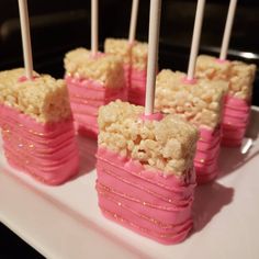 marshmallows are stacked on top of each other with candles sticking out of them