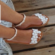 SHIPPING via DHL EXPRESS WORLDWIDE: 1 - 4 business days delivery (Please fill in your phone number if you choose Express Shipping) ★ More wedding sandals and shoes: See my store: https://www.etsy.com/shop/PelinoSandals 💓 Handmade genuine Greek leather wedding sandals decorated with romantic lace or crystals,pearls,rhinestones ( all the embellishments are hand sewn onto the leather straps) for brides dreaming of a beach wedding, a Bachelor party or even a city wedding. I am here to create with y Bridal Beach Sandals, Shoes Beach Wedding, White Sandals Wedding, Flat Sandals Wedding, Beach Wedding Sandals, Sandals Wedding, Leather Wedding, Handmade Sandals, Bridal Sandals