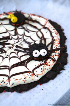 a spider web cake with sprinkles on it