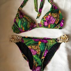 Brand New, Never Worn Swimsuit In A Fun Tropical Print. Bikini Top Is Size M And Bottom Is Size L, Medium Coverage.No Tags Attached. Fitted Purple Swimwear For Vacation, Fitted Purple Swimwear For Poolside, Fitted Tropical Print Swimwear For Party, Fitted Purple Swimwear For Beach Season, Purple Tropical Swimwear For Poolside, Purple Fitted Triangle Top Swimwear, Tropical Purple Swimwear For Pool, Purple Beachwear Tankini For Party, Fitted Tropical Print Triangle Top Swimwear