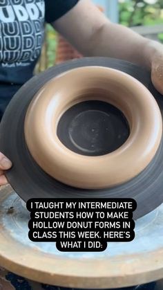 a person is holding a pottery bowl with a quote on it that says, i taught my intermediaate students how to make hollow donut forms in class this week here's what i did