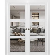 two white double doors open to a living room with couches and bookshelves